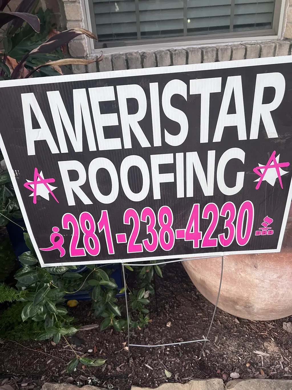 Ameristar Roofing yard sign showing the phone number and BBB accreditation mark