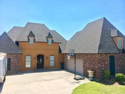 Completed two storey brick home with a full new roof, driveway and garage in view